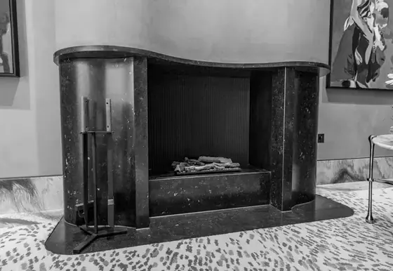 A JR Stone marble fireplace installed in a room